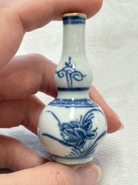 Ten Chinese blue and white miniature vases with figural and floral design, Kangxi
