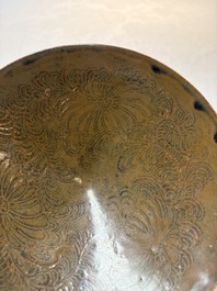 A Chinese Ding-type persimmon-glazed bowl with incised floral design, possibly Song