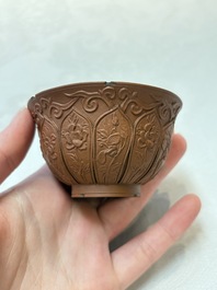 A set of five Chinese Yixing stoneware cups with floral design, Kangxi