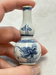 Ten Chinese blue and white miniature vases with figural and floral design, Kangxi