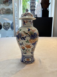 A pair of Chinese verte-Imari 'birds among flowering branches' vases and covers, Kangxi
