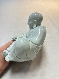 A Chinese famille rose Milefo Buddha and a white-glazed Milefo Buddha, 19th C.
