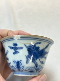 A pair of Chinese blue and white 'flying horses' cups, Jiajing mark, Kangxi