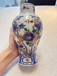 A pair of Chinese verte-Imari 'birds among flowering branches' vases and covers, Kangxi