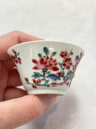 Two Chinese famille rose 'birds on flowering branches' cups and saucers, Yongzheng