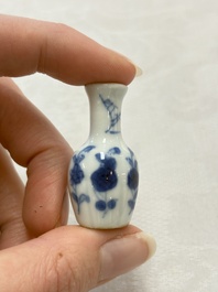 Ten Chinese blue and white miniature vases with figural and floral design, Kangxi