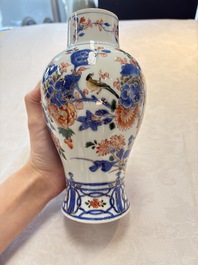 A pair of Chinese verte-Imari 'birds among flowering branches' vases and covers, Kangxi