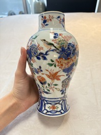 A pair of Chinese verte-Imari 'birds among flowering branches' vases and covers, Kangxi