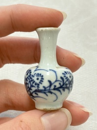 Ten Chinese blue and white miniature vases with figural and floral design, Kangxi