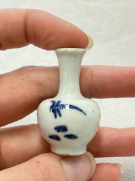 Ten Chinese blue and white miniature vases with figural and floral design, Kangxi