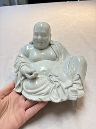 A Chinese famille rose Milefo Buddha and a white-glazed Milefo Buddha, 19th C.