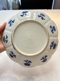 A pair of Chinese blue and white lotus-form 'Grasshopper' plates, Kangxi