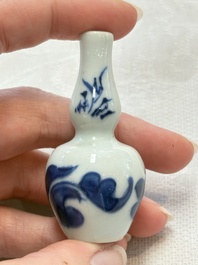 Ten Chinese blue and white miniature vases with figural and floral design, Kangxi
