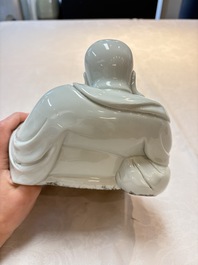 A Chinese famille rose Milefo Buddha and a white-glazed Milefo Buddha, 19th C.