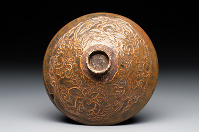 A Chinese Ding-type persimmon-glazed bowl with incised floral design, possibly Song
