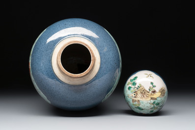 A Chinese famille verte powder-blue-ground 'fish and bird' vase and cover, 19th C.