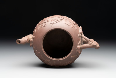 A Chinese Yixing stoneware 'squirrels among grape vines' teapot and cover, Kangxi