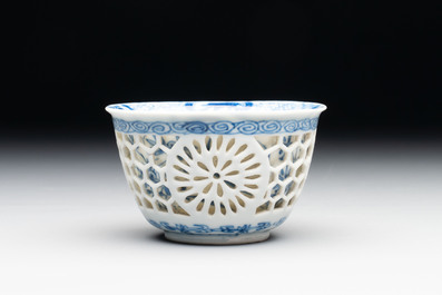 A Chinese blue and white reticulated double-walled cup, ruyi mark, Kangxi