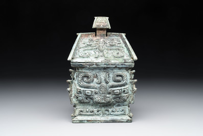 A Chinese archaic bronze inscribed wine vessel with buffalo design, 'fangyi 方彝', Western Zhou