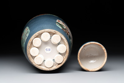 A Chinese famille verte powder-blue-ground 'fish and bird' vase and cover, 19th C.