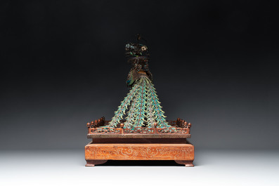 A large Chinese precious stone-inset and enamelled gilt-silver filigree peacock and flower basket on a wooden stand, Republic