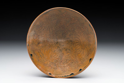 A Chinese Ding-type persimmon-glazed bowl with incised floral design, possibly Song