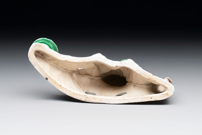A Chinese verte biscuit 'scholar' brush rest, Kangxi