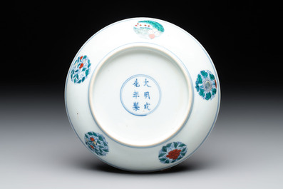A Chinese doucai plate with stylised floral design, Chenghua mark, Kangxi/Yongzheng