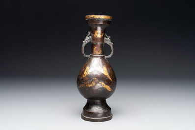 A Chinese parcel-gilt bronze vase with dragon-form handles, Yuan/Ming