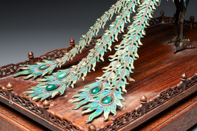 A large Chinese precious stone-inset and enamelled gilt-silver filigree peacock and flower basket on a wooden stand, Republic