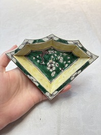 A Chinese verte biscuit 12-piece 'plum blossoms' sweetmeat set in a case, Kangxi