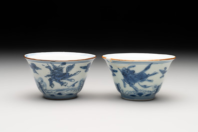 A pair of Chinese blue and white 'flying horses' cups, Jiajing mark, Kangxi