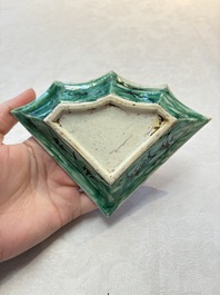 A Chinese verte biscuit 12-piece 'plum blossoms' sweetmeat set in a case, Kangxi