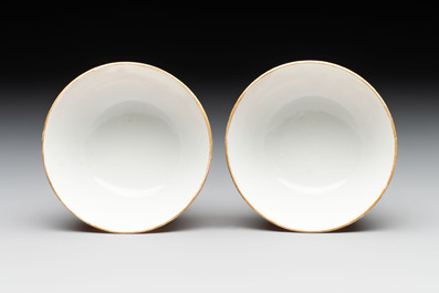 A pair of Chinese iron-red-decorated 'deer hunting' cups and saucers, Qianlong