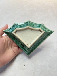 A Chinese verte biscuit 12-piece 'plum blossoms' sweetmeat set in a case, Kangxi