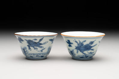 A pair of Chinese blue and white 'flying horses' cups, Jiajing mark, Kangxi