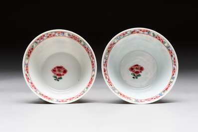 A Chinese famille rose 'roosters' covered teapot and two cups and saucers, Yongzheng