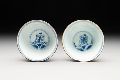 A pair of Chinese blue and white 'flying horses' cups, Jiajing mark, Kangxi