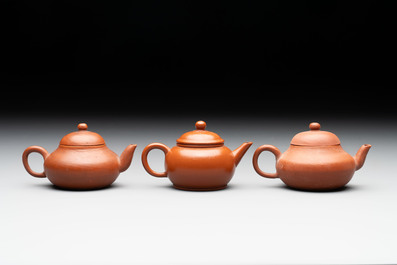 A small Chinese Yixing stoneware covered teapot and two Swatow Yixing-style covered teapots, Yixing Hui Mengchen 宜興惠孟臣製 and Shunji 順記 marks, 19/20th C