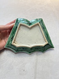 A Chinese verte biscuit 12-piece 'plum blossoms' sweetmeat set in a case, Kangxi