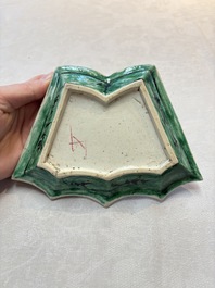 A Chinese verte biscuit 12-piece 'plum blossoms' sweetmeat set in a case, Kangxi
