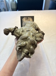 A Chinese stoneware cream-glazed sculpture of a warrior, possibly Tang