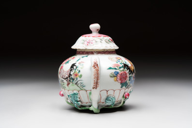 A Chinese famille rose 'roosters' covered teapot and two cups and saucers, Yongzheng