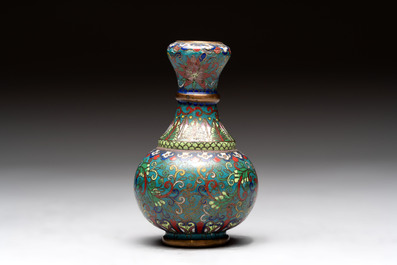 A pair of Chinese cloisonn&eacute; candlesticks and three vases, 19/20th C.