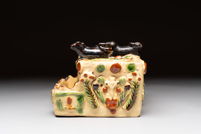 A polychrome-glazed inkwell with relief design, possibly Italy or France, 18/19th C.