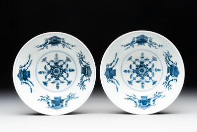 A pair of Chinese famille rose ruby-sgraffito-ground 'antiquities' bowls, Daoguang mark, 19/20th C.