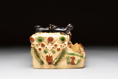 A polychrome-glazed inkwell with relief design, possibly Italy or France, 18/19th C.