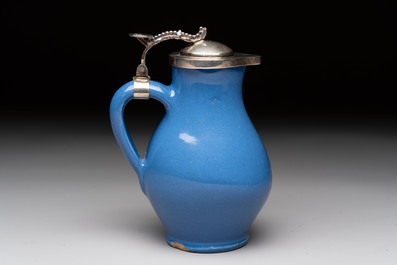 A very rare blue-glazed Dutch Delft jug with a mounted silver cover, 18th C.