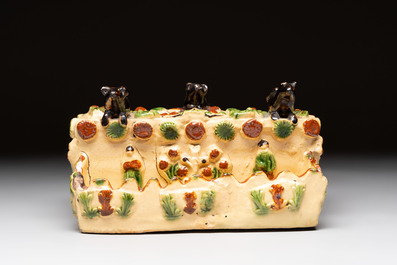 A polychrome-glazed inkwell with relief design, possibly Italy or France, 18/19th C.