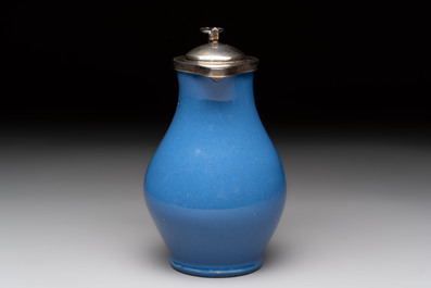 A very rare blue-glazed Dutch Delft jug with a mounted silver cover, 18th C.